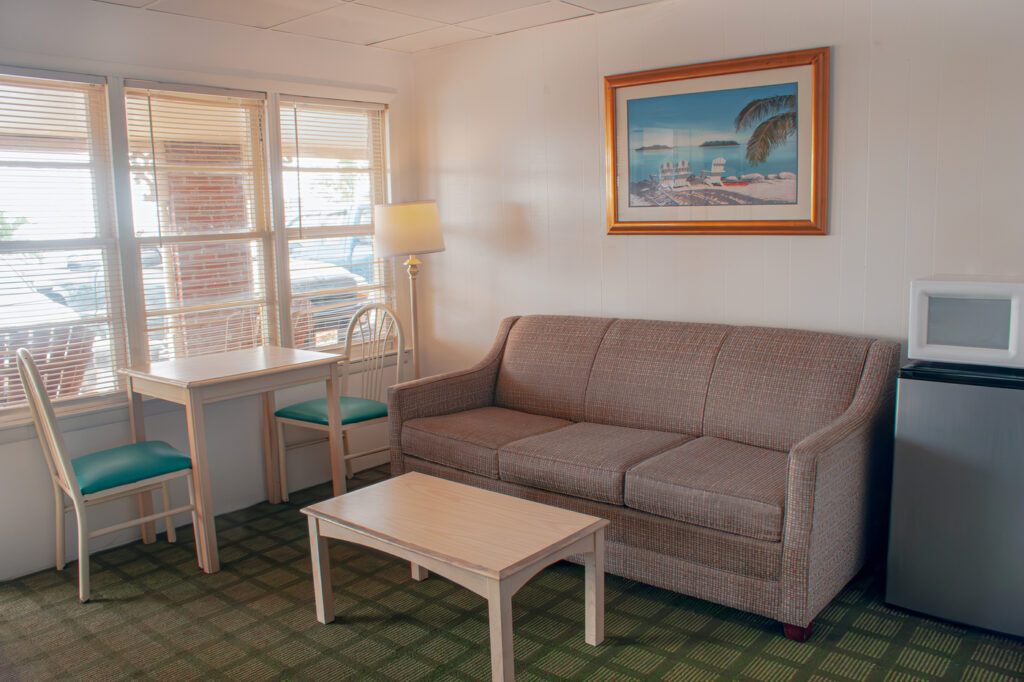 sofa, tables and chairs in motel