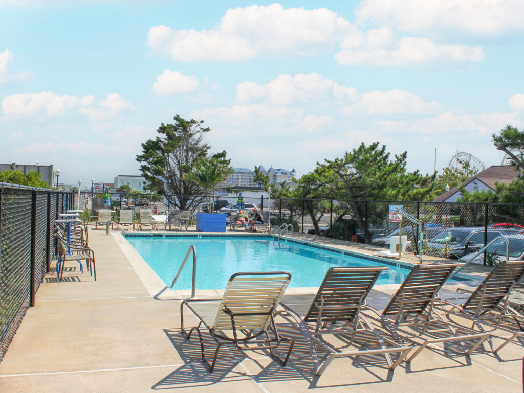 motel pool with beach chairs